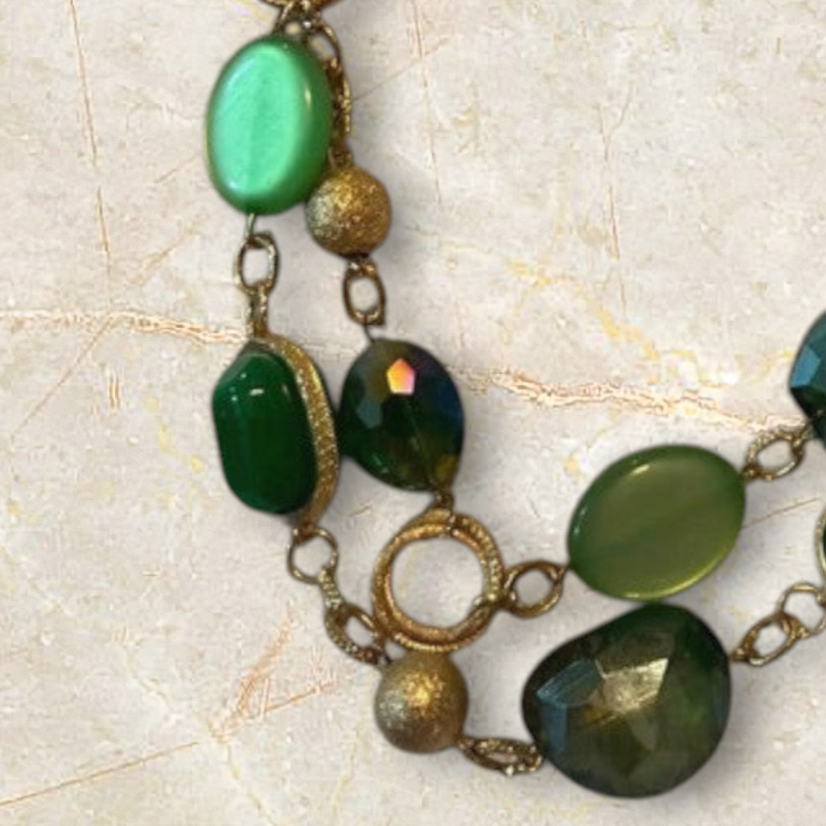 Velvet Leopard Vintage NYC multi-strand gold chain necklace featuring faceted emerald green and lime beads