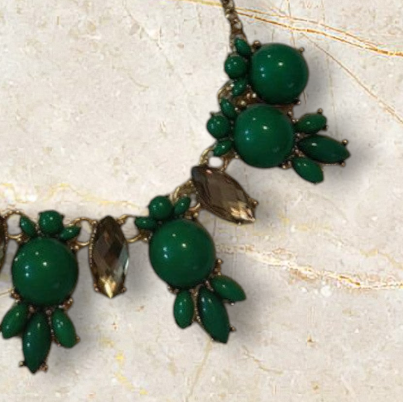 Velvet Leopard Vintage NYC statement necklace with emerald green beads and faceted crystals on a gold-tone chain.